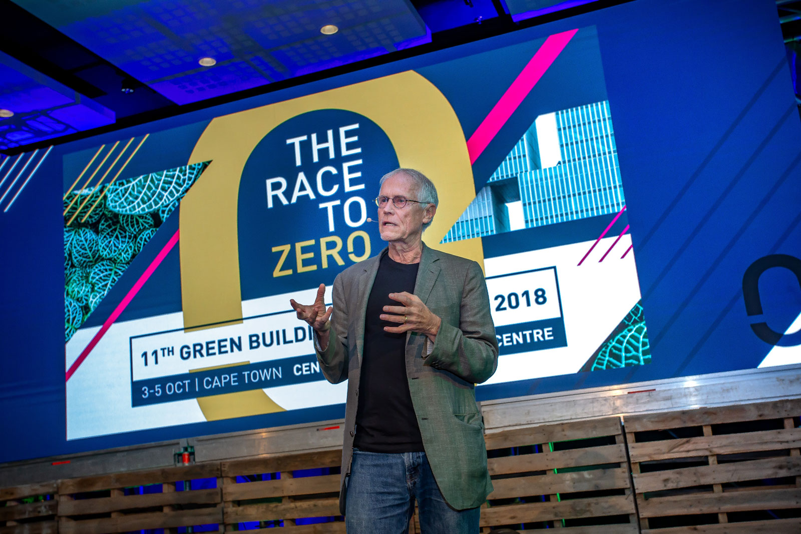 Paul Hawken speaking with a powerpoint background